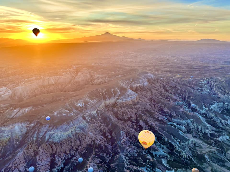 Hot air balloons fly over Turkey.