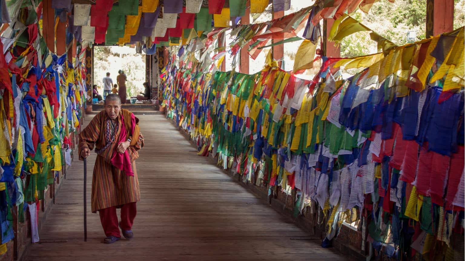 Bhutan-Thimphu-Buddist-Prayer-Flags-Monk-Bridge-Mai-Anh-Dinh-banner