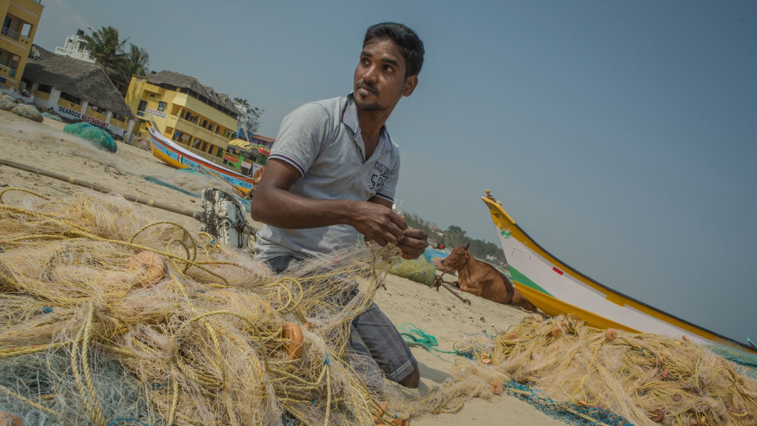 India Mamallapuram Fisherman Unwinding Fishing Nets Cropped