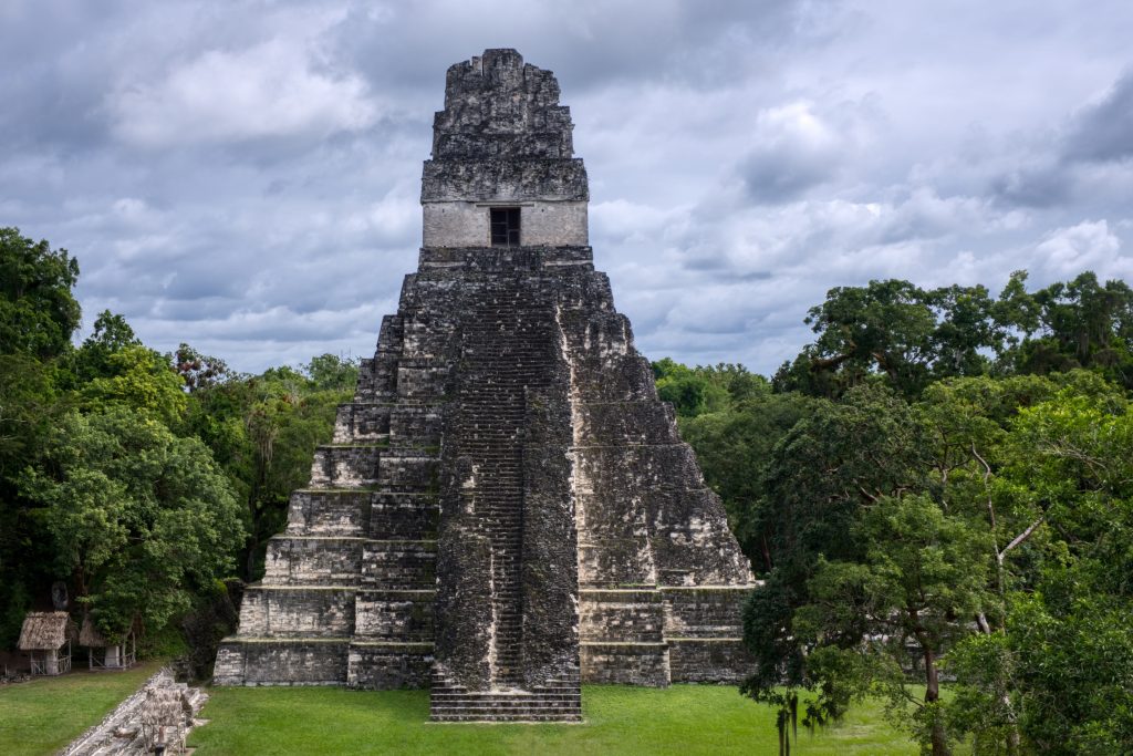 A view of the Mayan pyramid of Tikal (Temple III) from the distance.